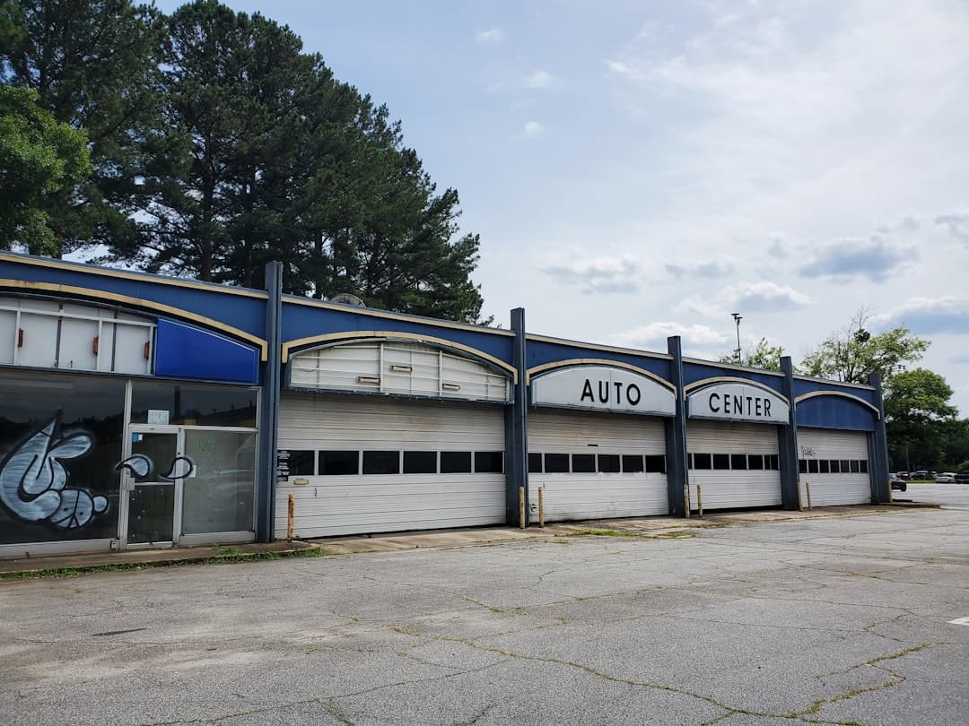 Inside the bustling auto shop with mechanics at work.